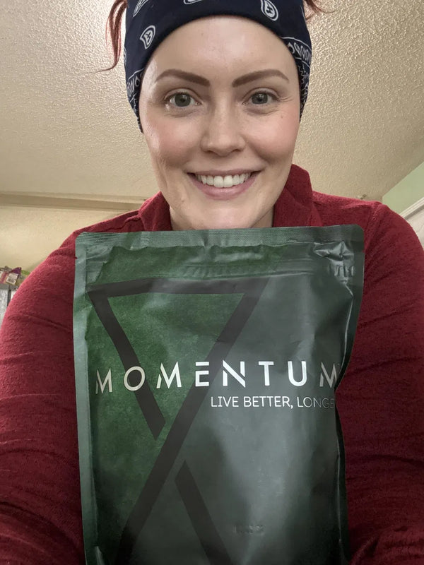 Momentum customer holding a bag of Momentum Shake