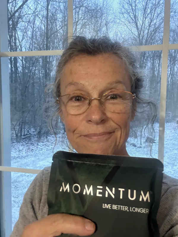 Momentum customer holding a bag of Momentum Shake