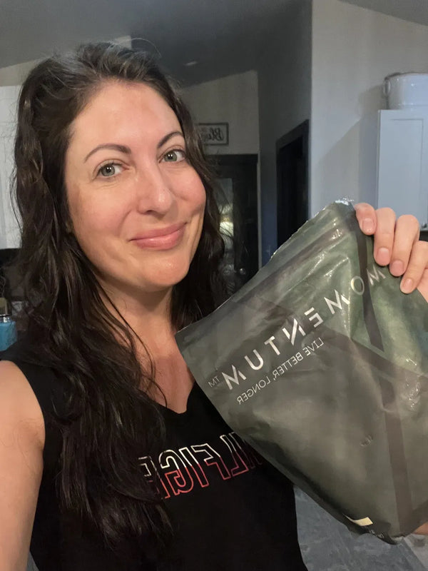 Momentum customer holding a bag of Momentum Shake